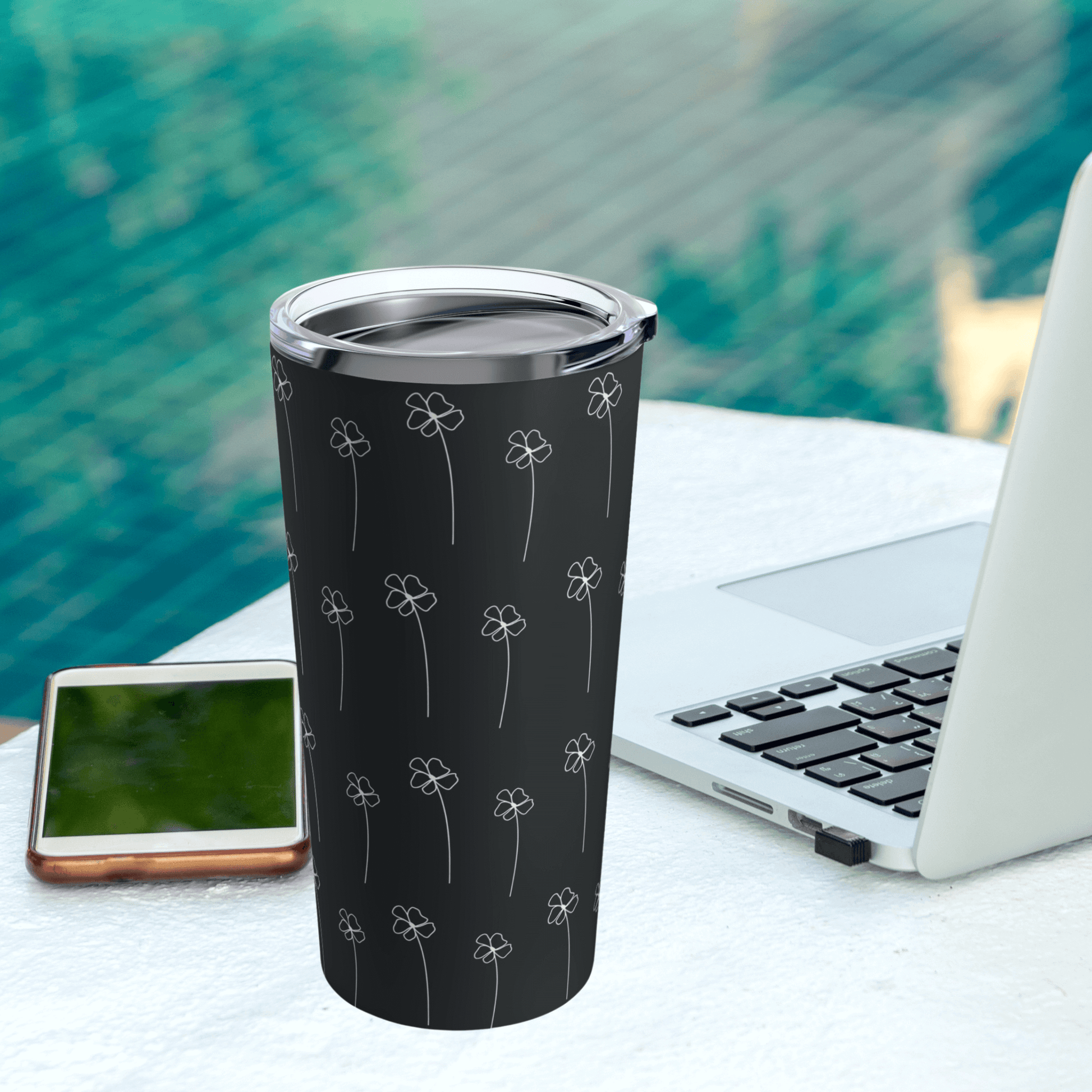 Our durable coffee travel mug looks great next to a computer by the pool to keep your drinks cold on a hot day.