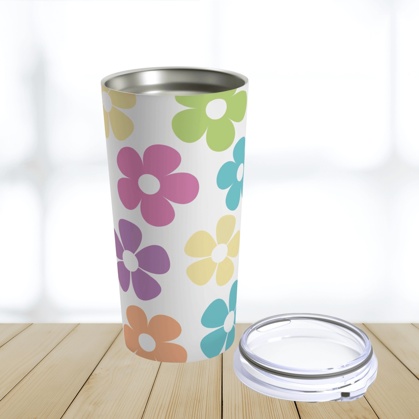 OUr cute tumbler is the perfect gift under thirty dollars for any woman. The pinks, blues purples orange and lime green flowers have a retro feel. This shows the stainless steel cup that is dishwasher safe and the clear lid.