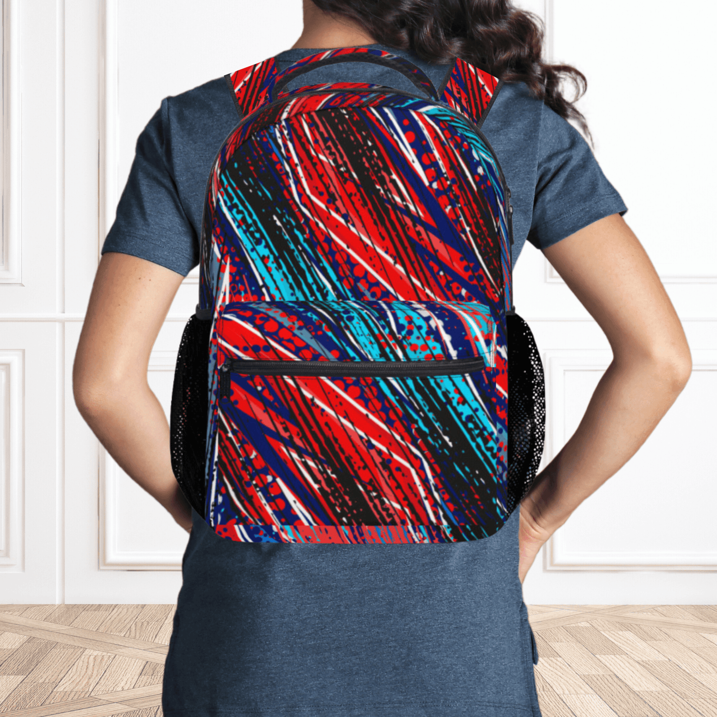 Our paint spatter backpack for kids is black, red and shades of light blue and dark blue and is a custom backpack for boys.