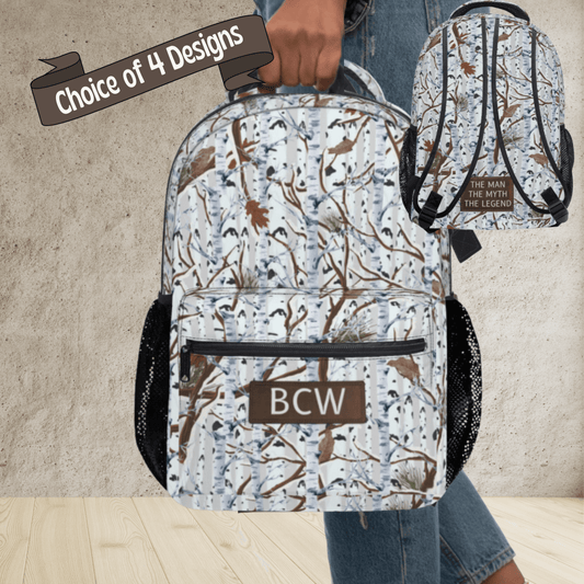 Backpack with bird pattern and 'BCW' initials, held by a person wearing jeans.