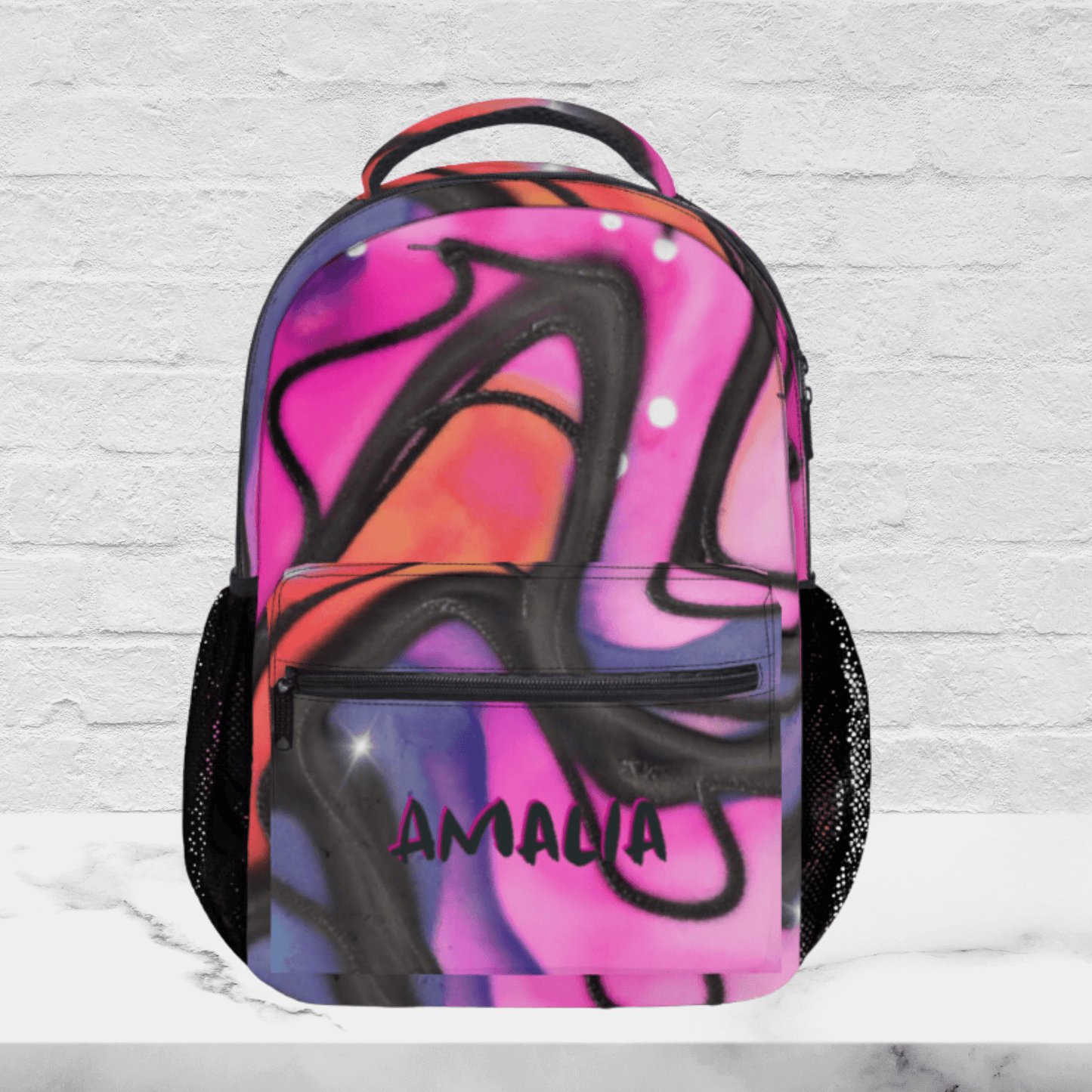 Our pink backpack for kids and teens shows the personalized name in black.
