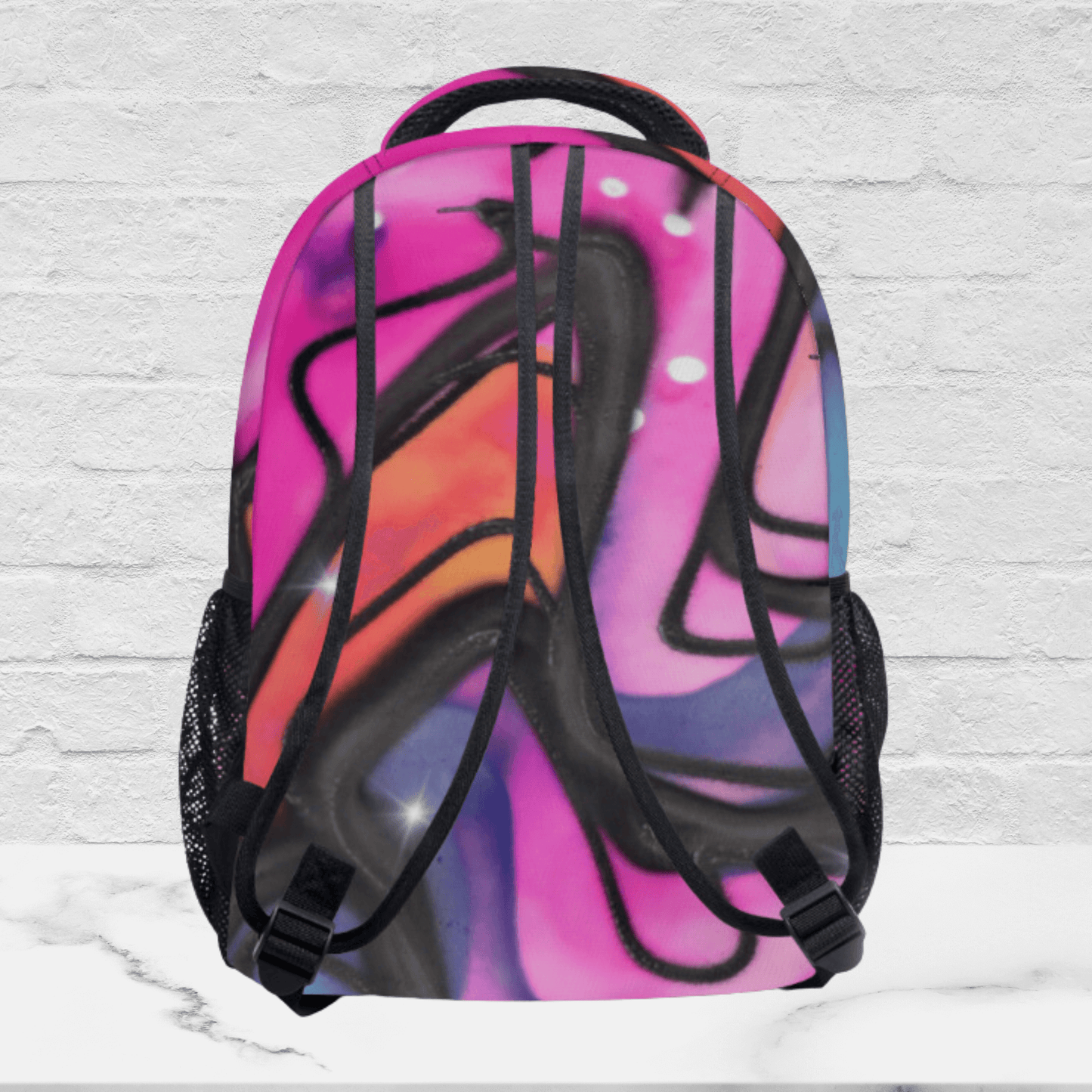 All sides of our pink backpack for kids and teens shows the colorful print on all areas of the backpack.