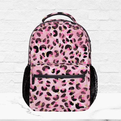 Up close view of the plain pink leopard print backpack shows a padded top handle and mesh pockets on both sides.