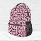The side of the pink back to school backpack shows a black mesh pocket for water bottles or additional storage.