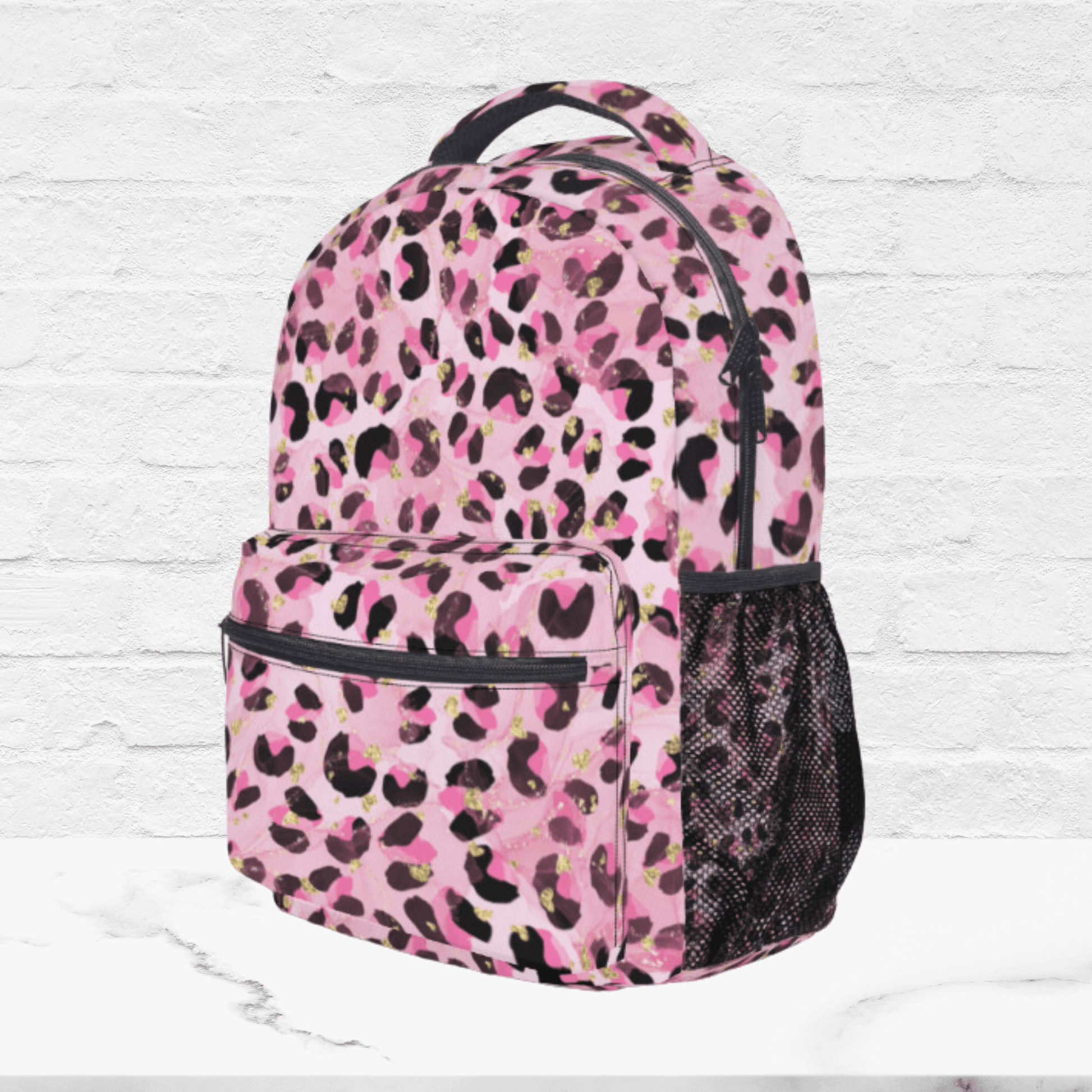 The side of the pink back to school backpack shows a black mesh pocket for water bottles or additional storage.