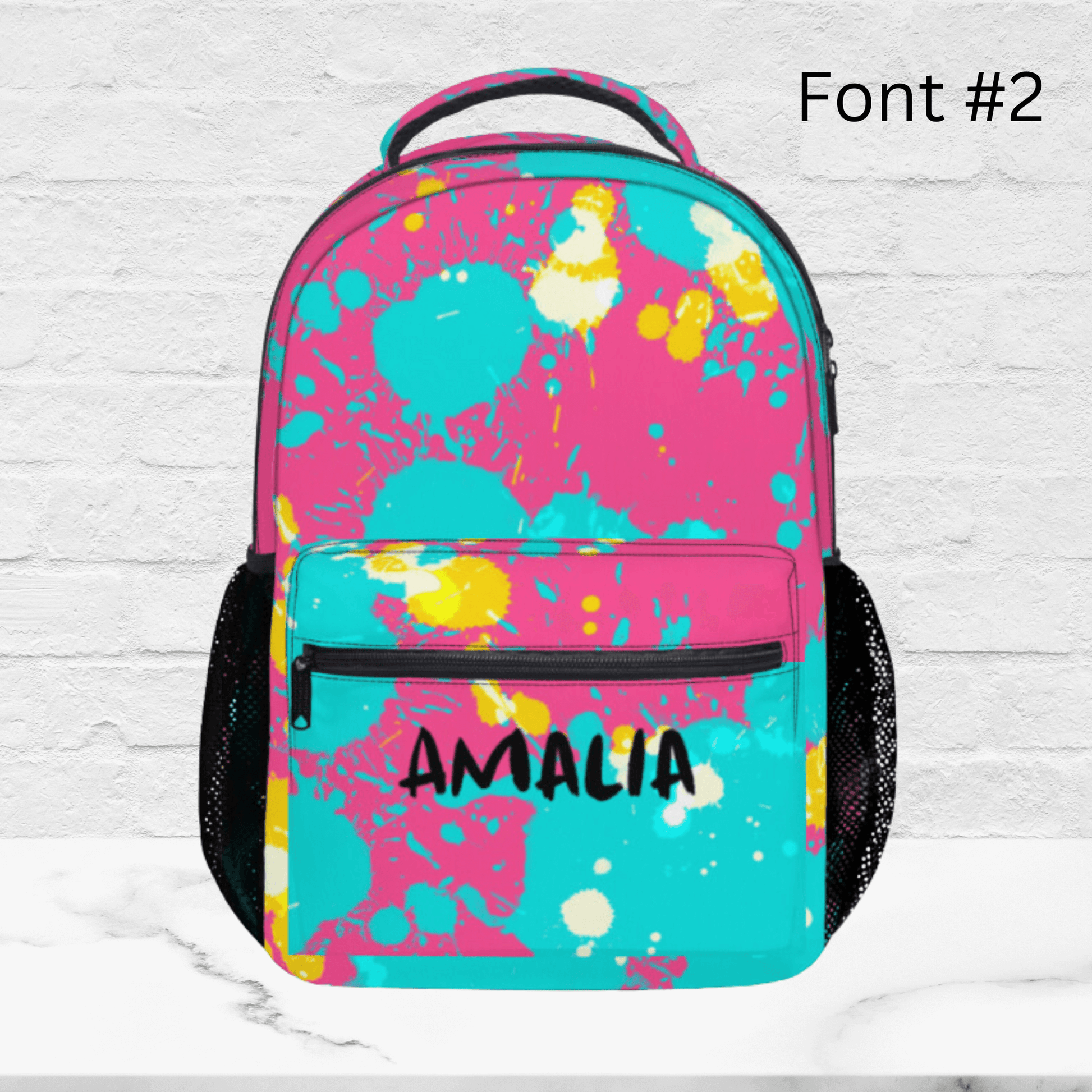 Our pink paint splatter backpack with font two. 