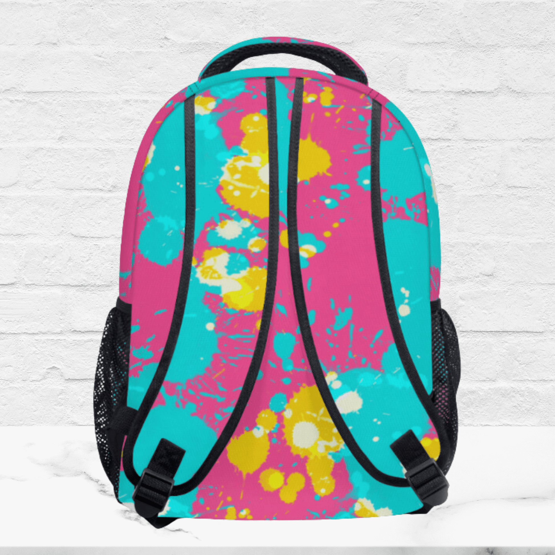 The backside of our turquoise and pink backpack for kids.