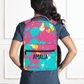 Our pink paint splatter backpack shown wearing the backpack on a model.