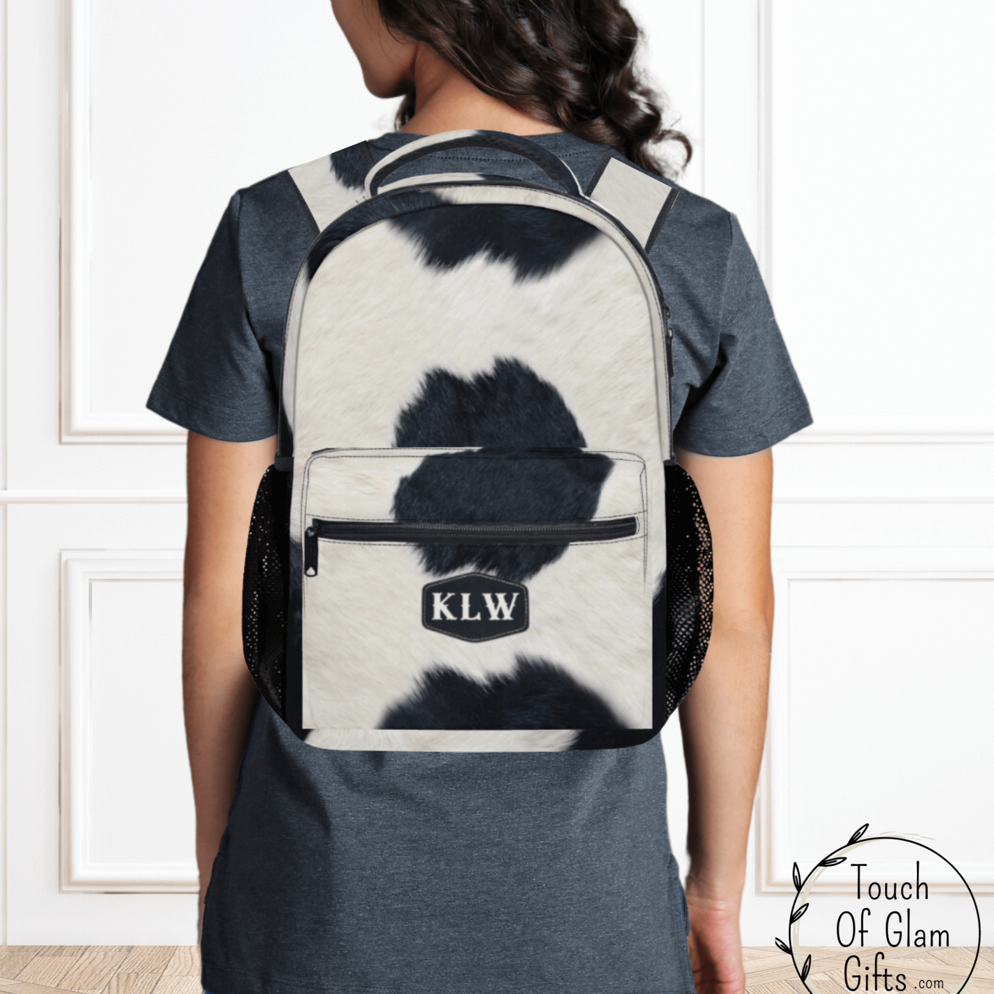 Our black cowhide backpack with monogrammed initials