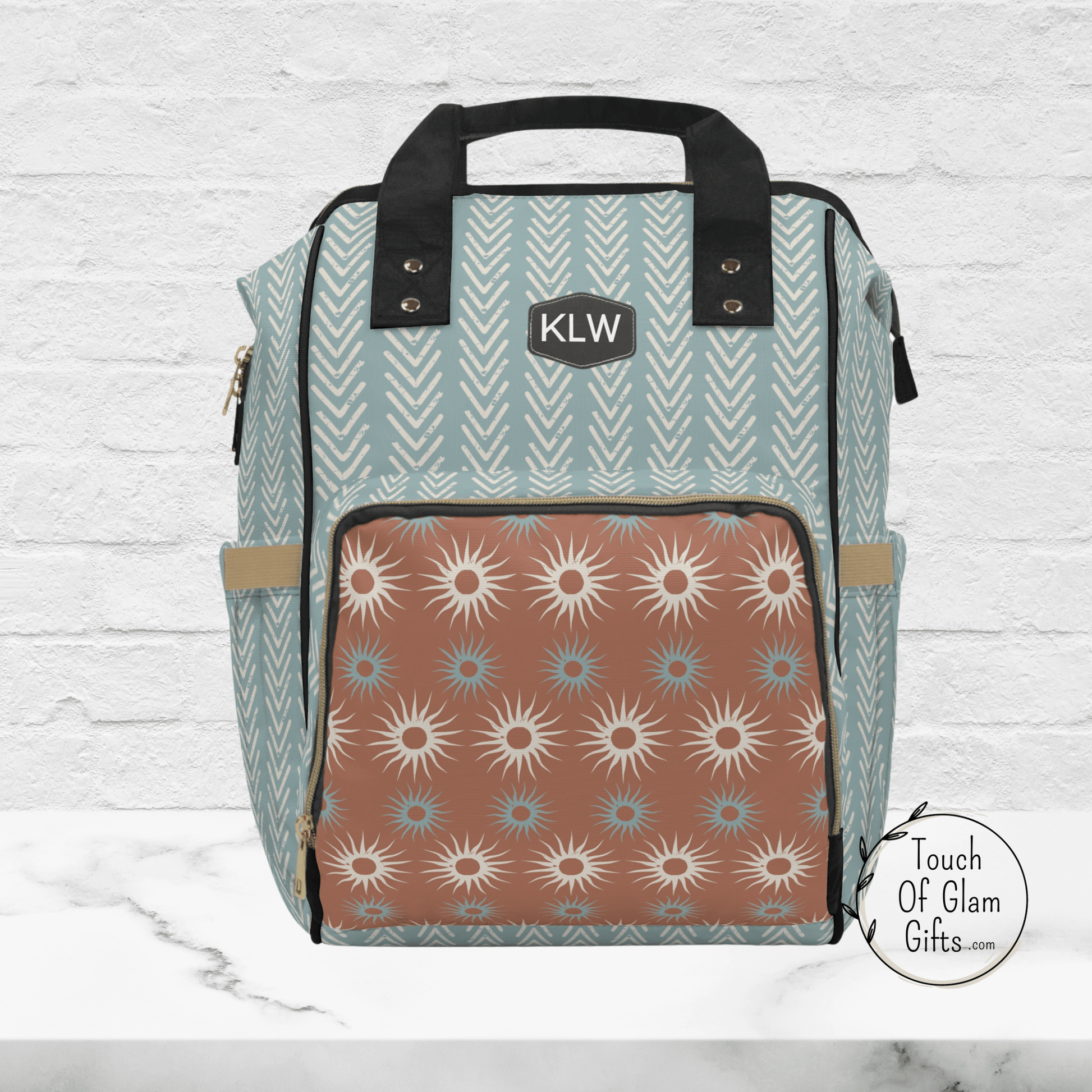 This boho diaper backpack looks like a stylish travel bag and not a diaper baby bag because its so cute. The black accents with black piping on the edges makes the sage green color pop.