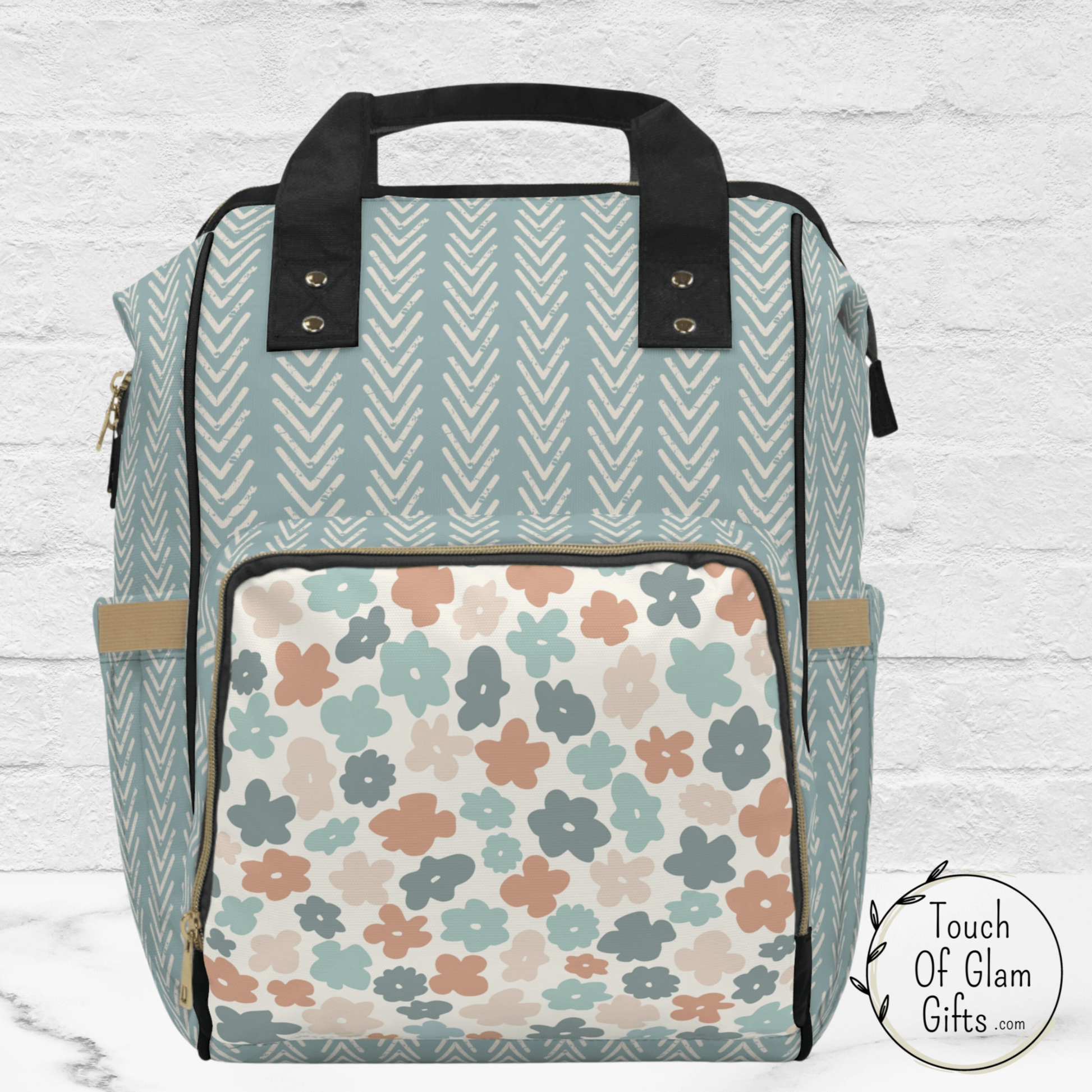 This cute diaper bag backpack makes carrying kids stuff around much trendier. This bag makes a great hands free travel backpack for women at the airport too.  The boho colors are great for any outfit.
