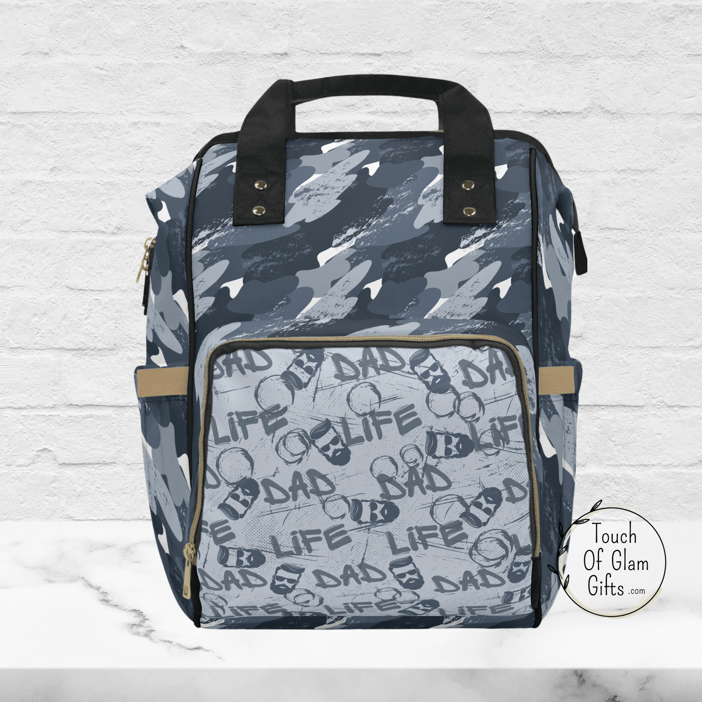 Gone are the days of Dads carrying around feminine diaper bags. This Dad Life, blue camouflage backpack provides a masculine solution for dads on the go, allowing them to carry all the essentials for their baby, while still looking cool.