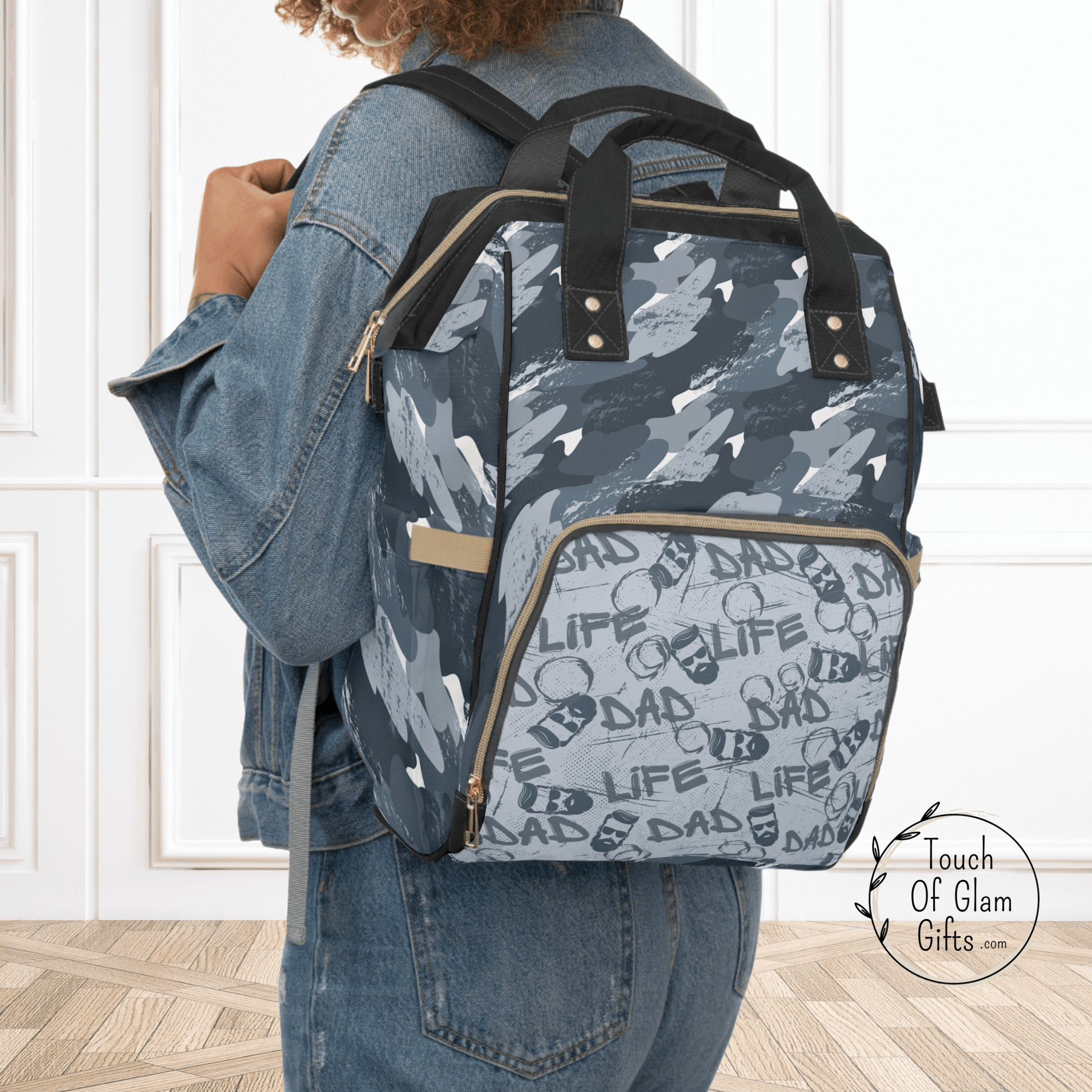 The perfect gift for new dads. This diaper bag backpack has a masculine design for men that get stuck holding the diaper bag. The backpack design allows fathers to be hands free while tending to their kids.