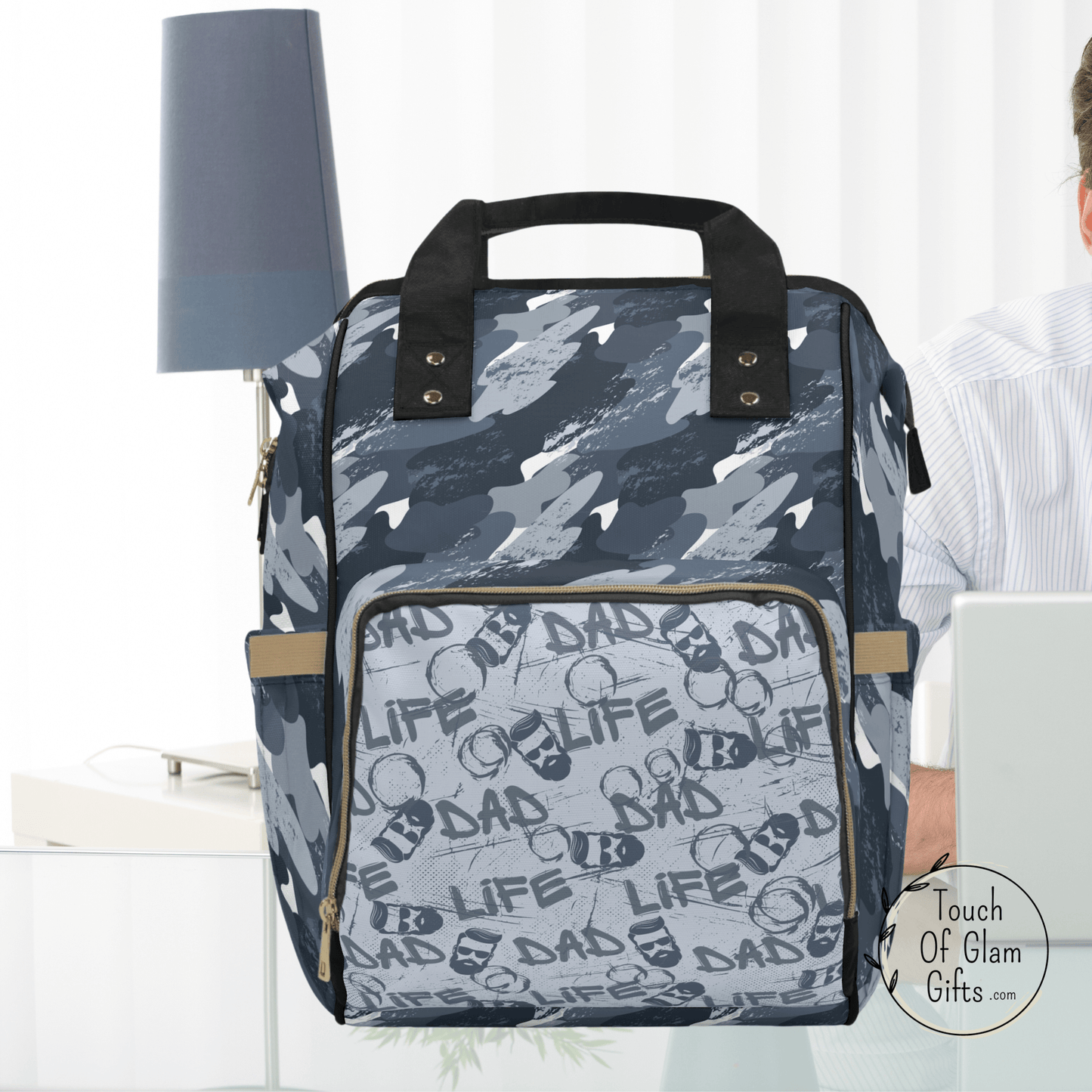This dad has his dad life diaper bag ready to go on his desk. This stylish masculine backpack is the perfect Fathers day gift for new dads. Dads dont want to carry a feminine diaper bag and love the fact someone thought of them.