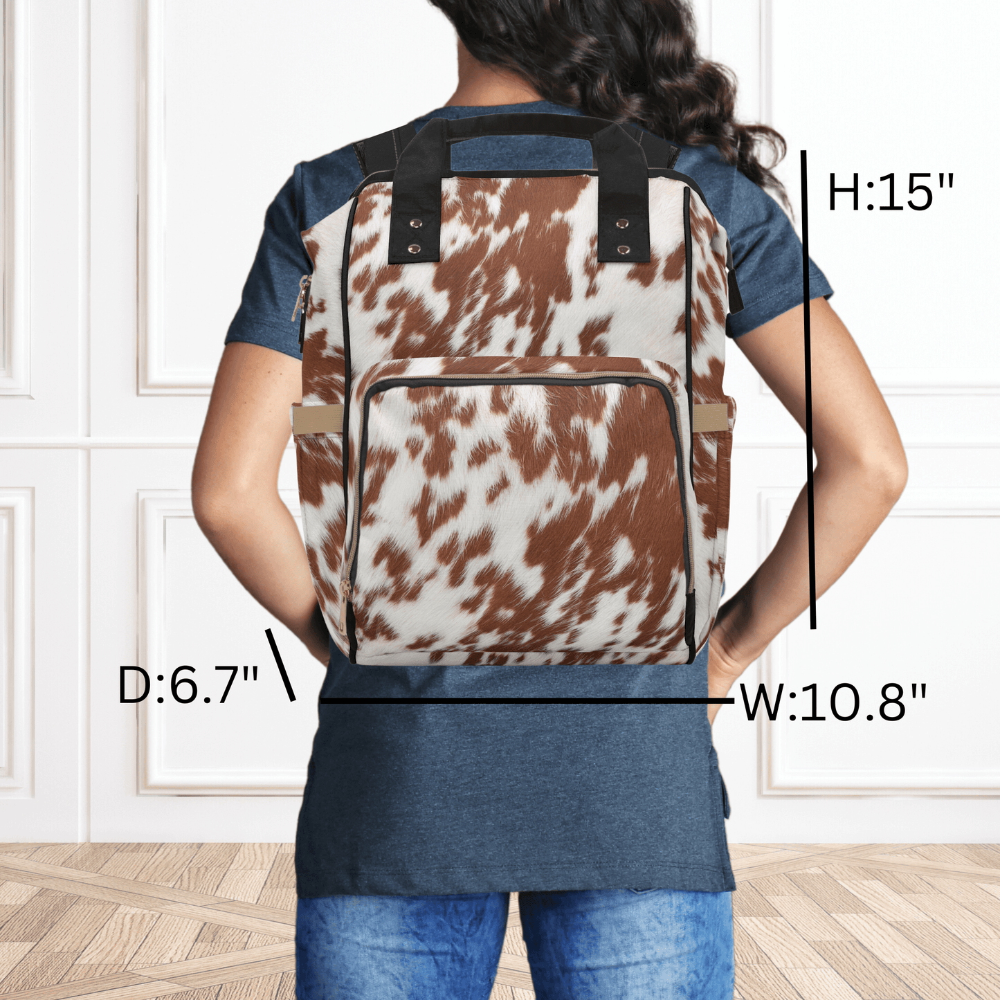 The western diaper bag is shown wearing as a backpack and shows the height depth and width of the backpack.