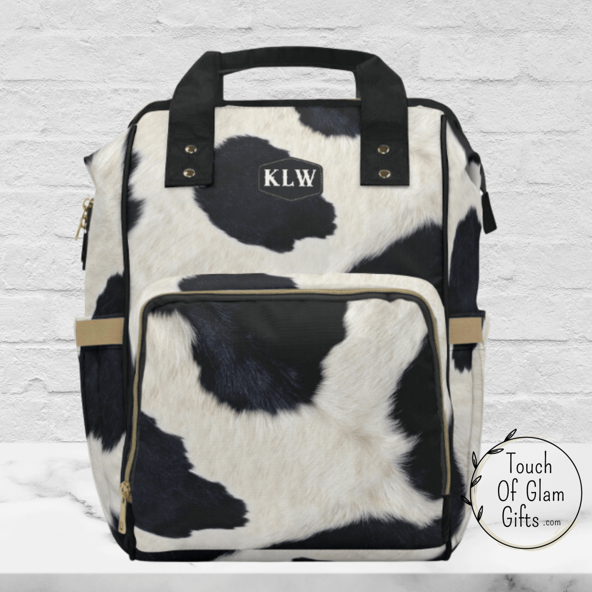 Our black and white diaper backpack can be personalized with up to 3 initials. This diaper backpack is a great personalized gift for a baby shower gift and mom to be.