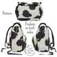 All angles of our cowhide diaper backpack shows the black and white cowprint on the bottom and sides. There is pockets on both exterior sides for holding water bottles.