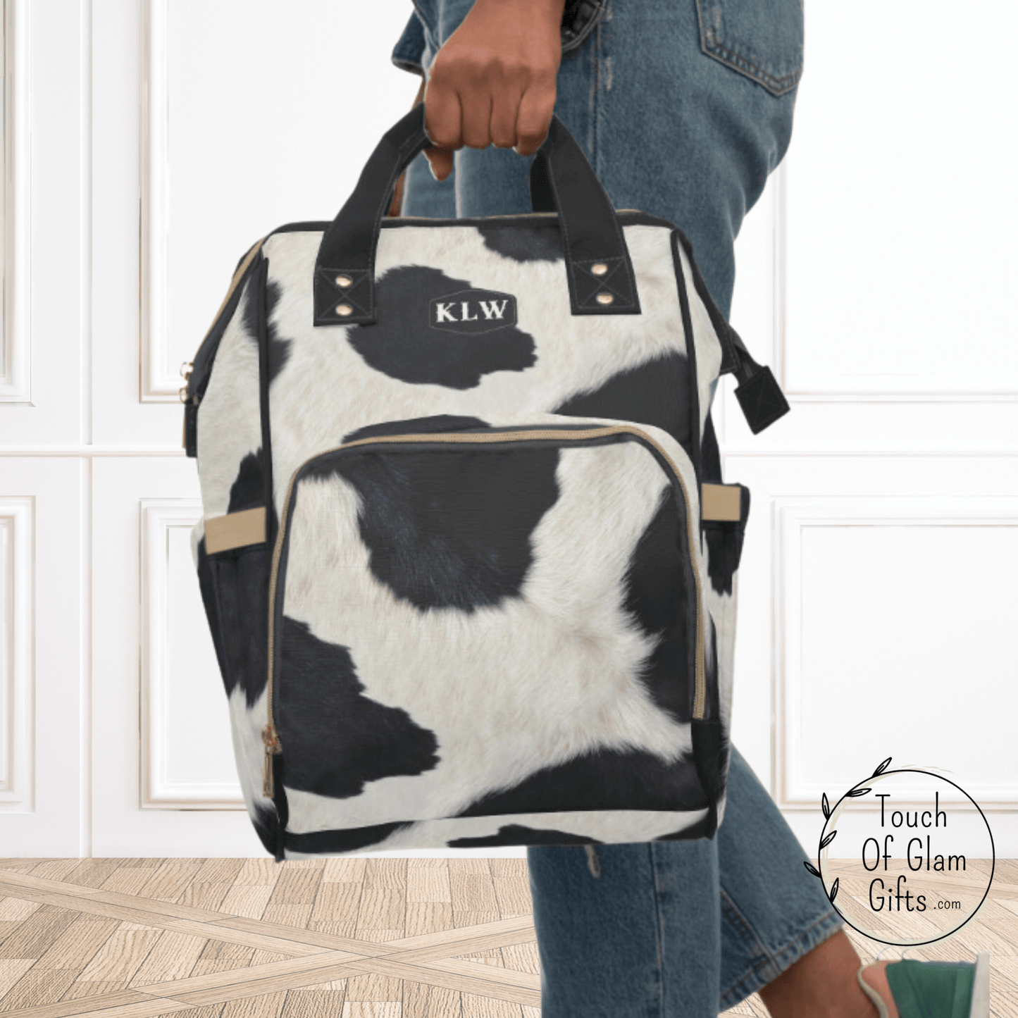 Our black and white cowhide backpack can be carried with handles too as shown here.