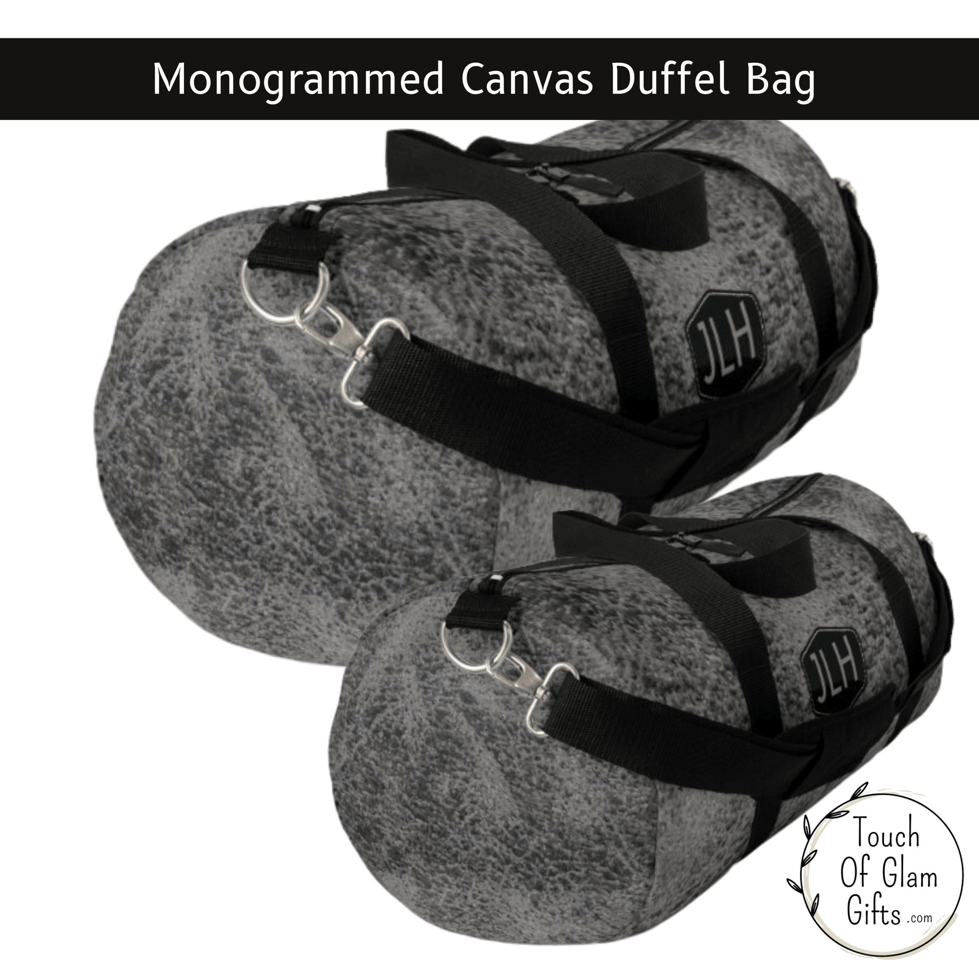 A view of the sides shows grey weathered print on canvas duffel bag with monogrammed initials and the black handles and black shoulder strap with metal hardware.