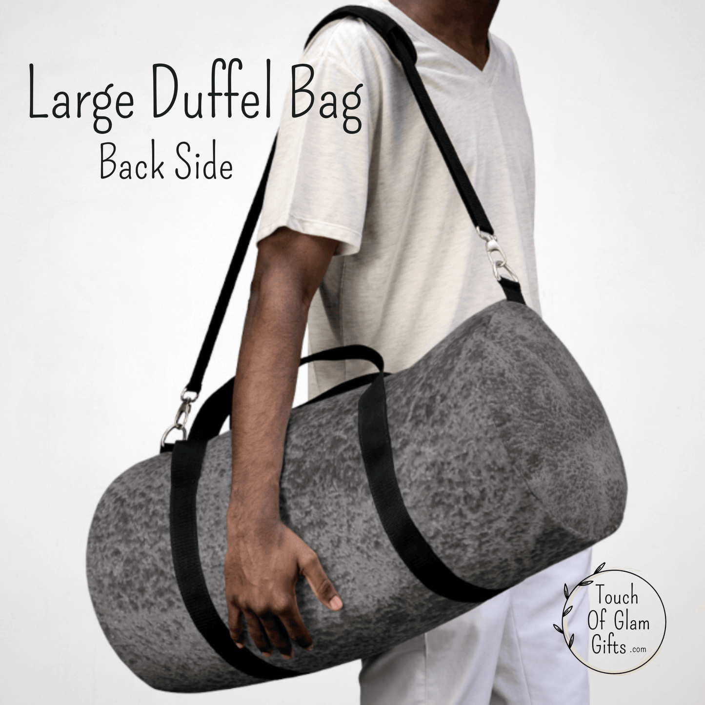Our large mens duffel bag is shown on a male model with the padded shoulder strap to show the size of the large bag.