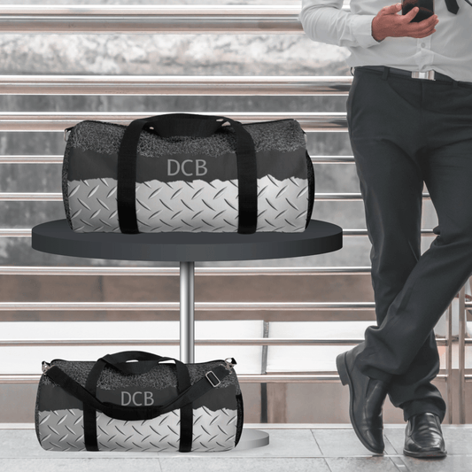 Masculine duffel bag for men with dark gray leather print, monogram initials and steel print on canvas for a sleek manly travel bag.