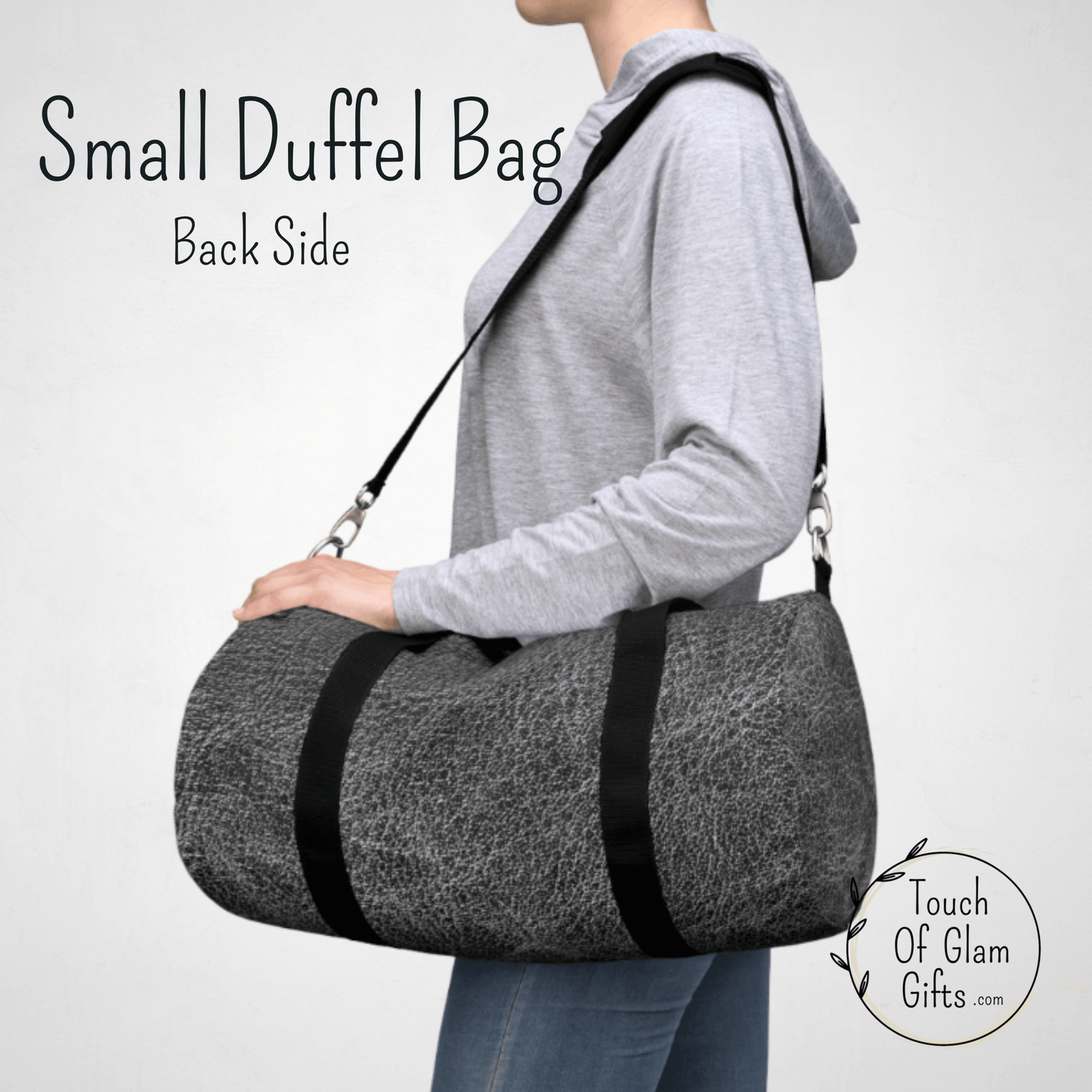 Our small mens duffel bag is shown on a female model to show the size. Perfect for a weekend bag or large purse.