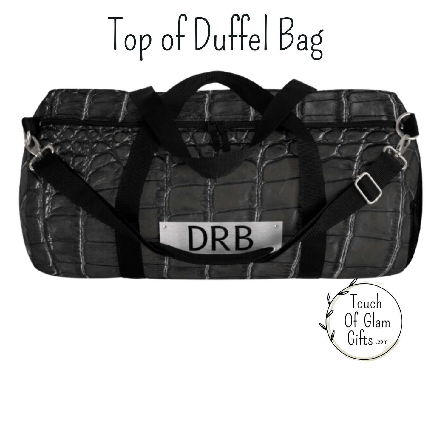 The top view of the black snakeskin duffel bag shows a quality zipper with two zipper heads for convenience.