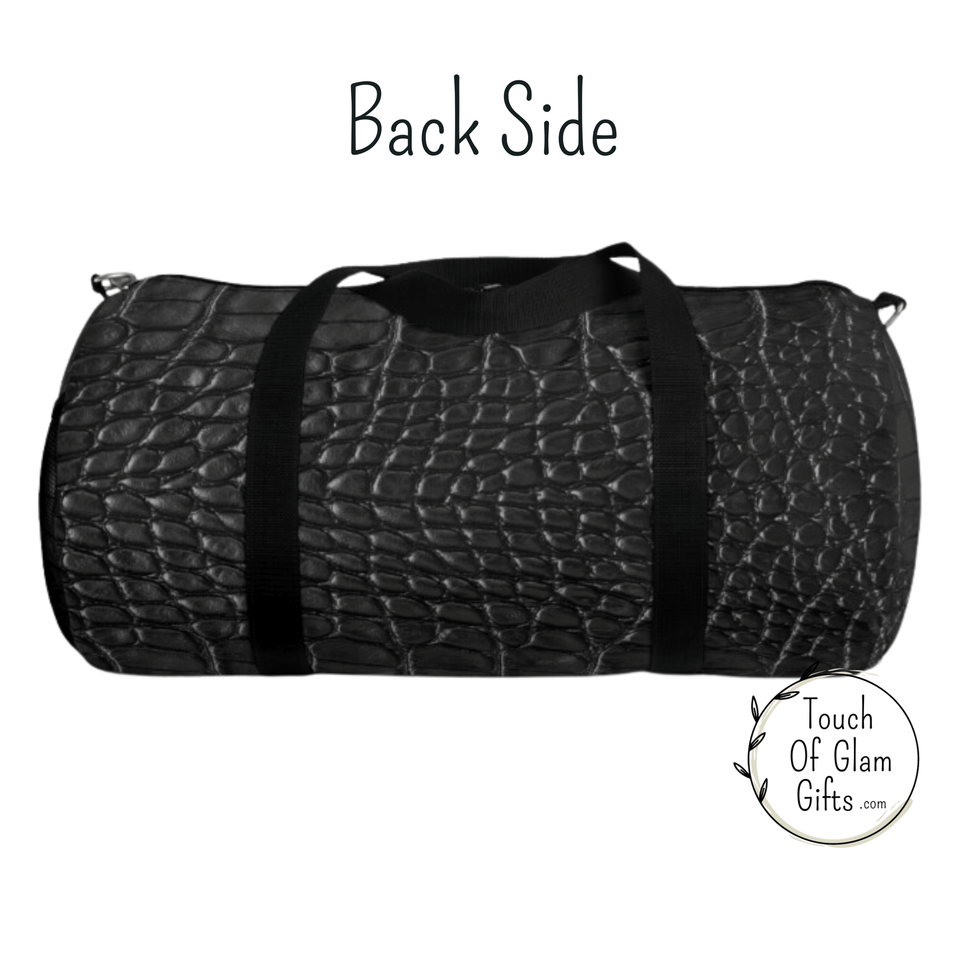 The back side of the duffel bag shows the faux dark grey snakeskin print on canvas duffel bag. 