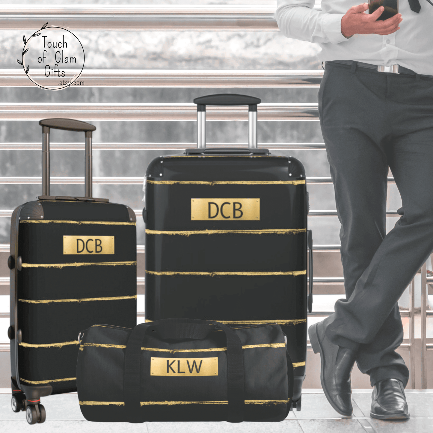 Our black and gold duffel bag matches our line of hard shell luggage with wheels. The line of travel gear can be monogrammed and personalized for the perfect gift. This picture shows two suitcases and a duffel bag, all matching.