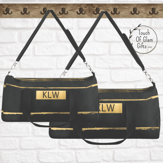 Our dark grey canvas bag with gold distressed stripes comes in two sizes. Both sizes are the same quality and print. Our black duffel bags are both hanging on a hook to show the size of both travel bags for men and women.