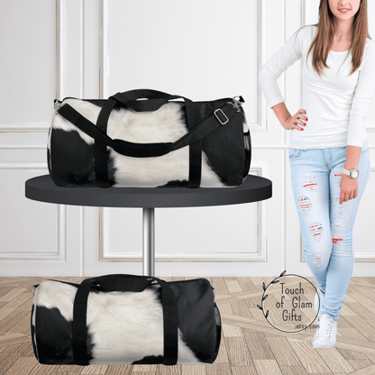 Our cowhide duffel bag is shown without personalization and shows the large cow print bag and the small cow print bag.