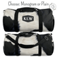 Choose monogrammed cowhide duffel bag with up to three initials or enjoy the cowhide bag plain.