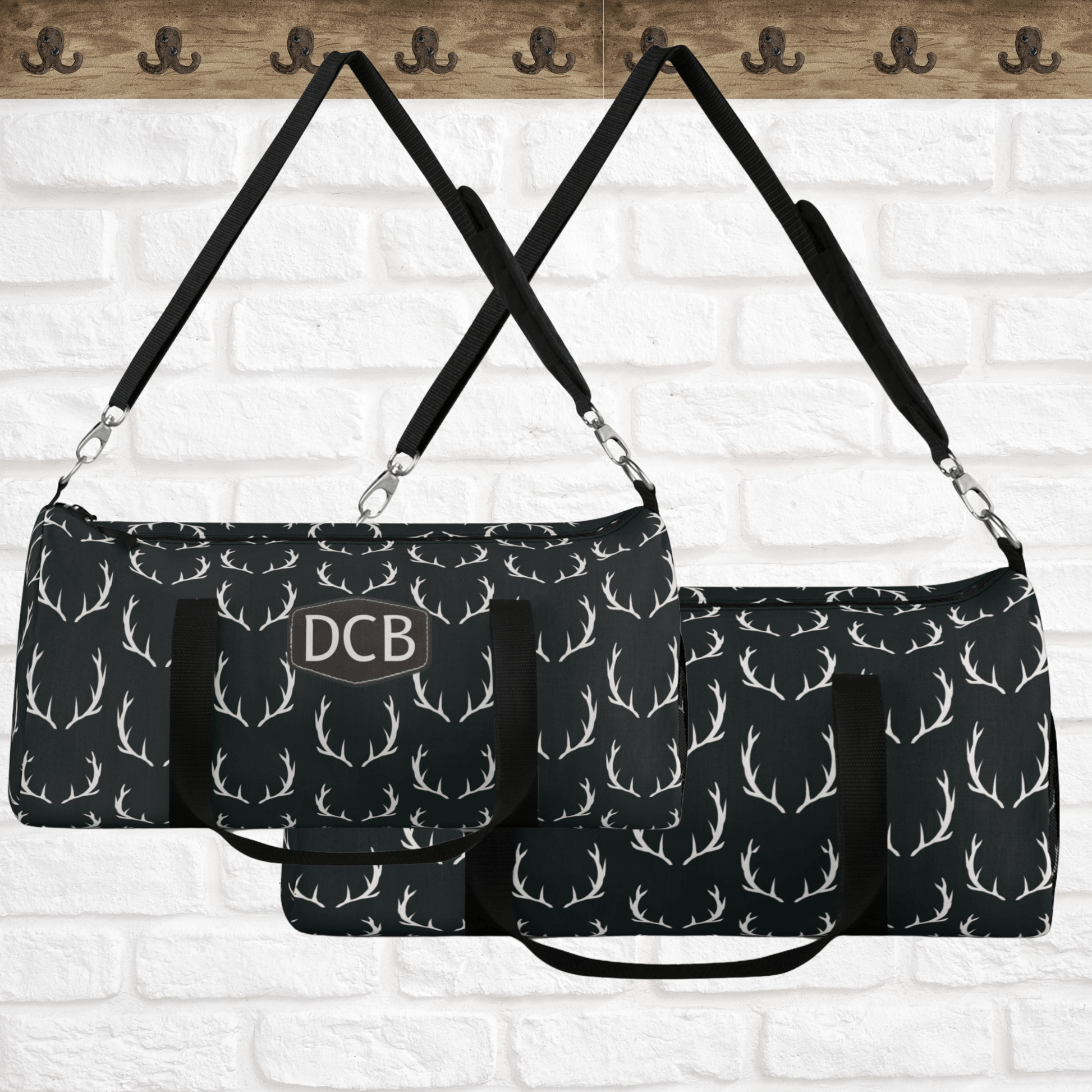 Our deer antler designer weekend bag makes the perfect gift for hunters or fathers day. This black duffel bag is shown in large or small size and can be monogrammed or enjoyed plain.