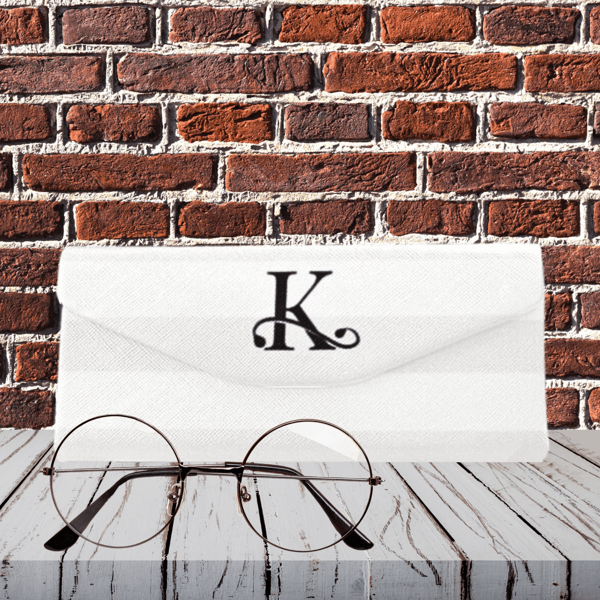 Our custom, foldable eyeglass cases are designed to collapse into a compact size when not in use. shown in front of brick wall to see striped details.