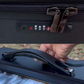 A close up view of the rubber handle and the lockable zipper.