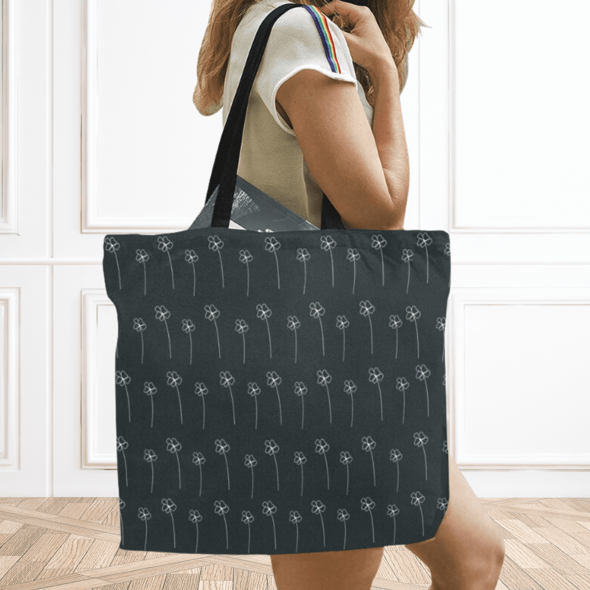Black boho farmhouse shopping tote bag over the shoulder purse on model.