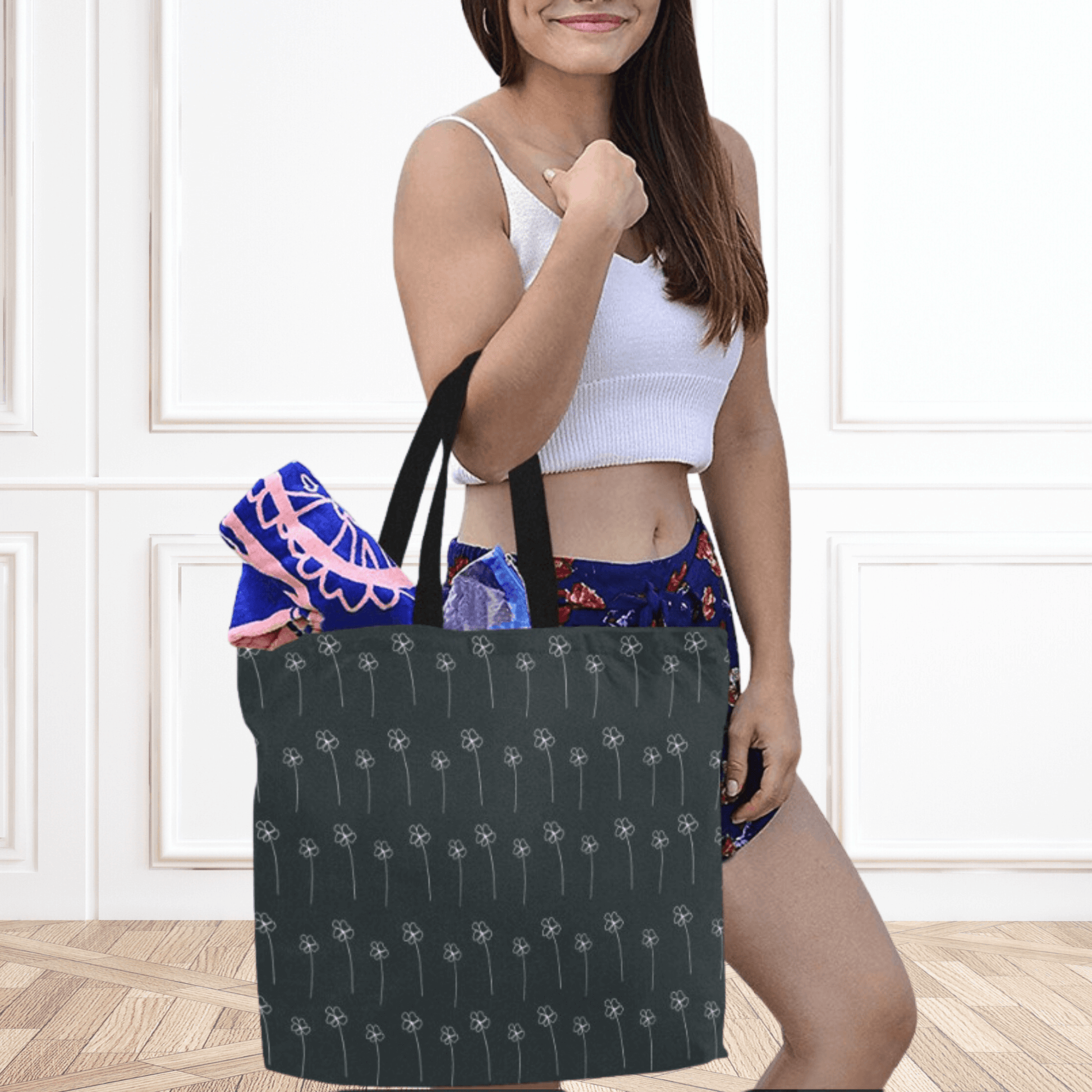 Black handles make carrying this tote easy for our model