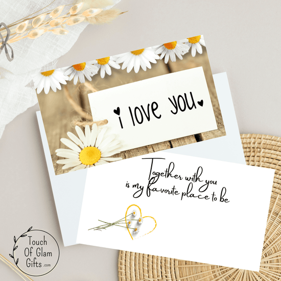 This free valentines day card digital download has daisy flowers and says I love you. On the inside of the card it says, together with you is my favorite place to be.