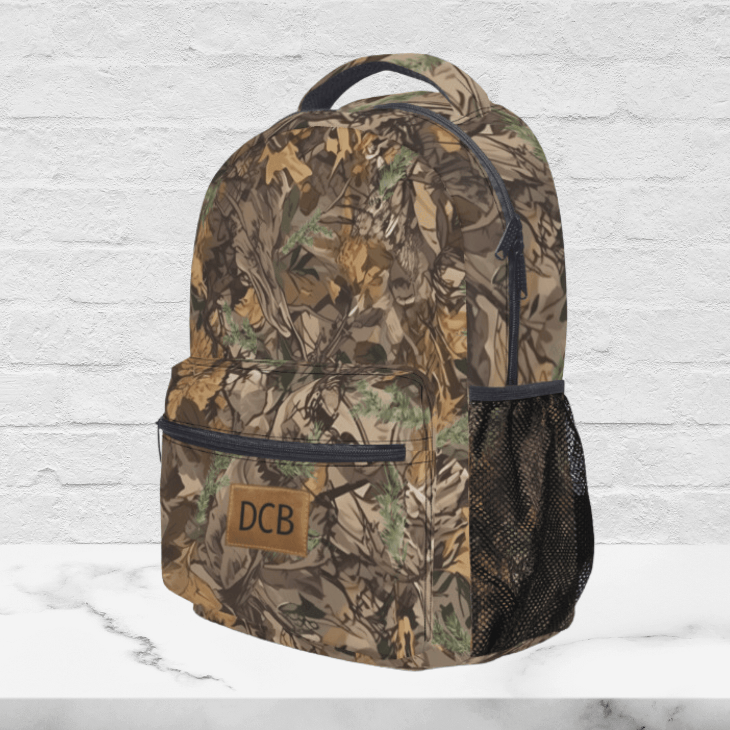 A side view of the monogrammed backpack for deer hunters shows the quality zipper and mesh pockets on both sides.