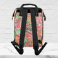 The back side of our tropical backpack shows the tropical print and black padded straps.