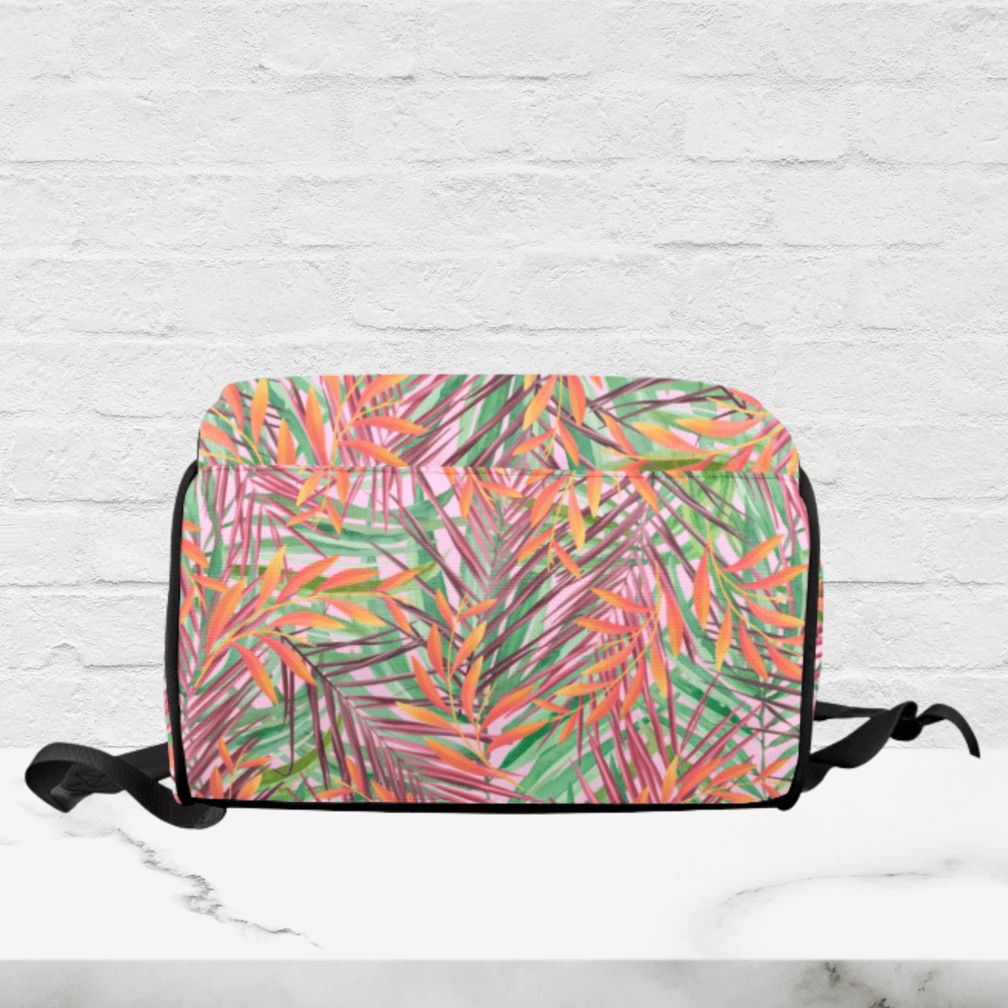 The bottom of the diaper bag is the tropical print design.