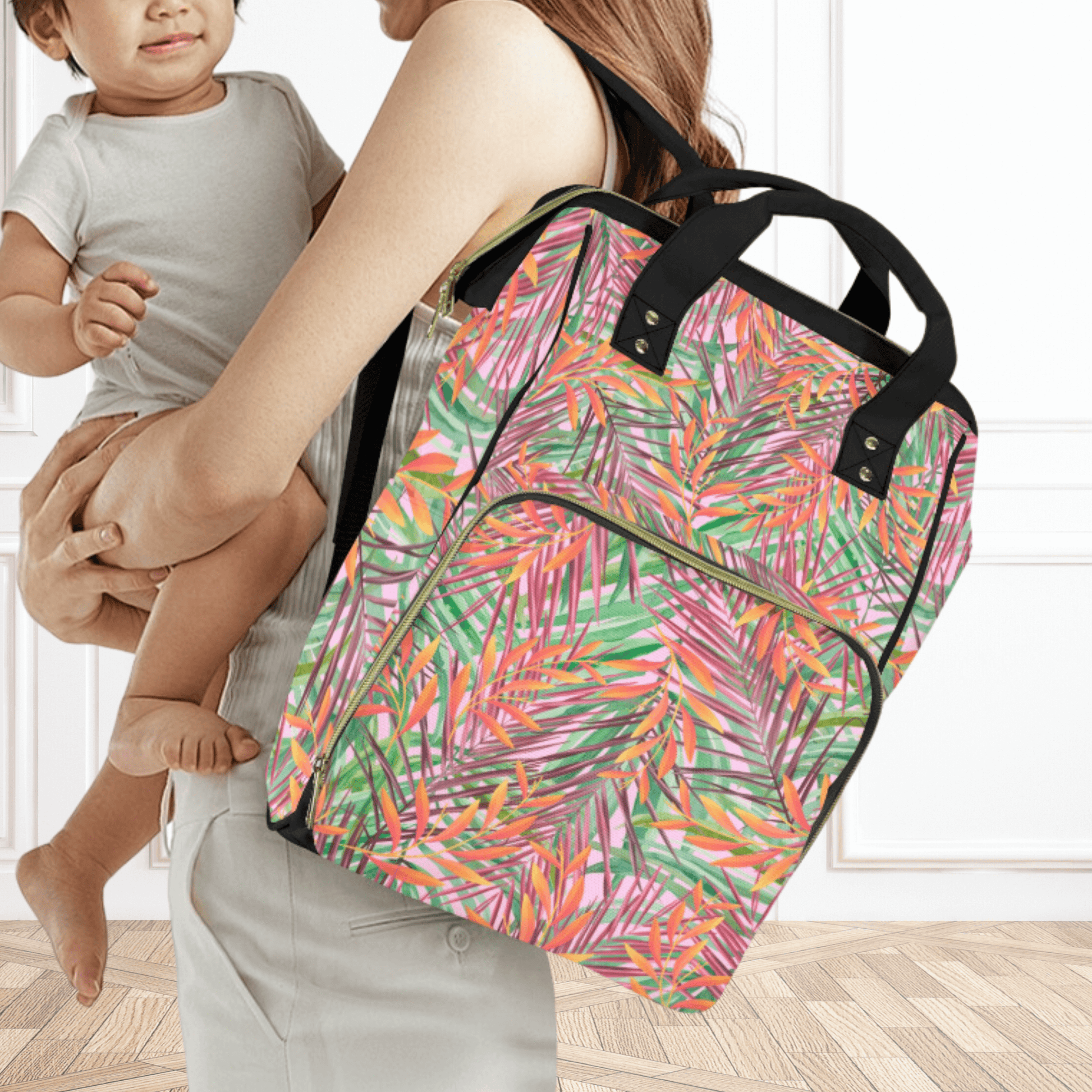 mom and baby with diaper backpack in tropical colors.