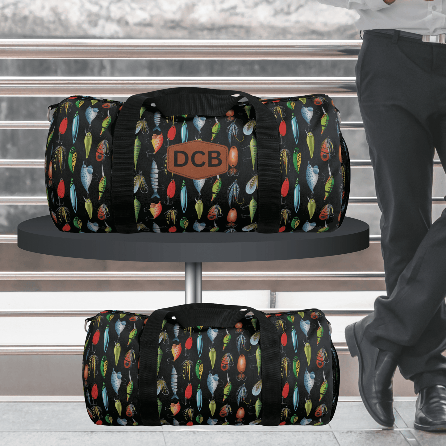 This monogrammed fishing lure duffel bag makes the perfect gift for any fishermen or outdoorsmen. The black bag with colorful lures can be personalized with their initials.