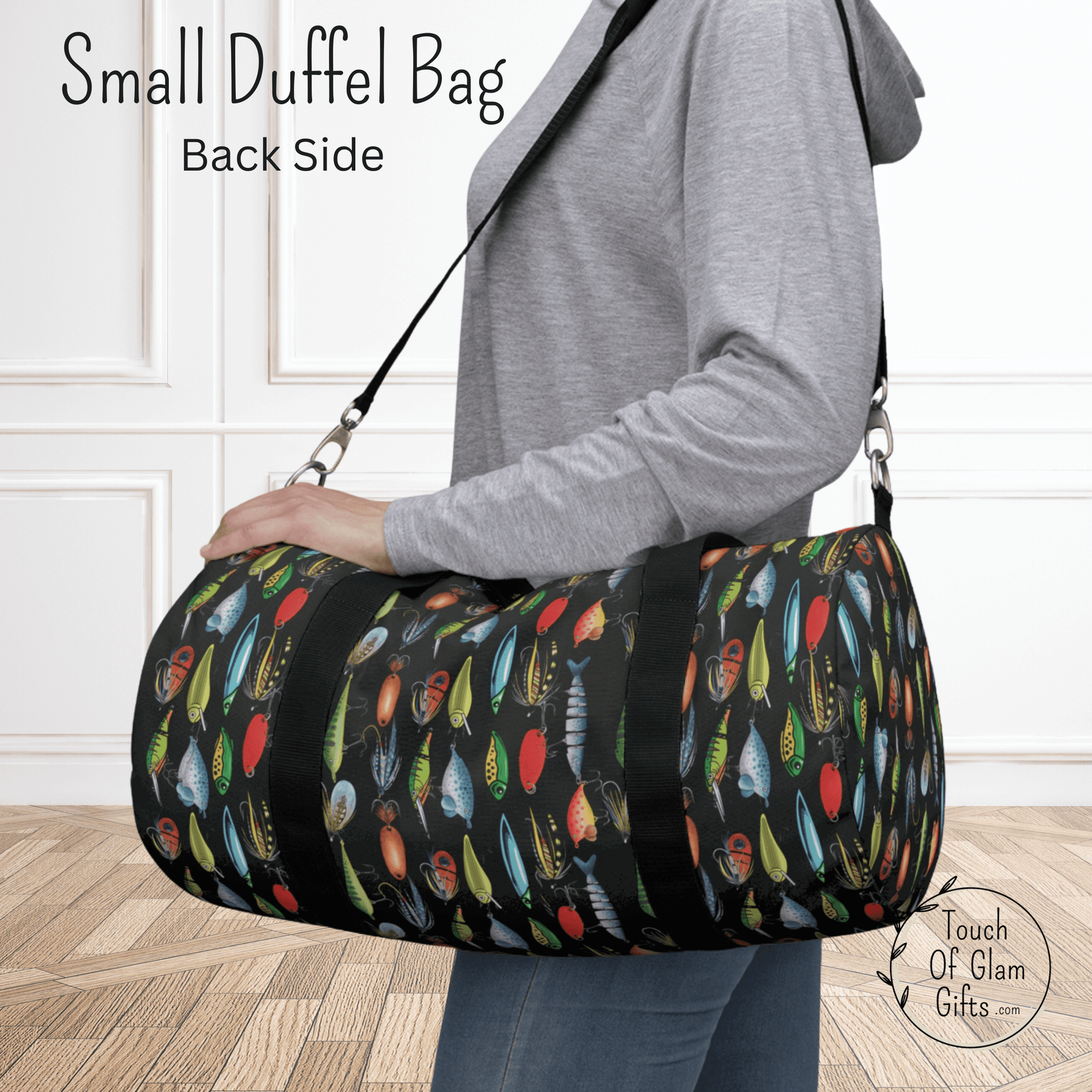 Our fishing lure shoulder bag or weekender bag for men or women who love fishing is shown in the small duffel bag size on a model.