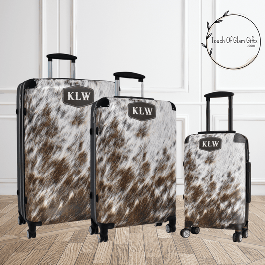 this picture shows the customized version of our cowhide luggage. Brown and off white cow print makes it look real. The initials are printed on the bag for longer lasting results.