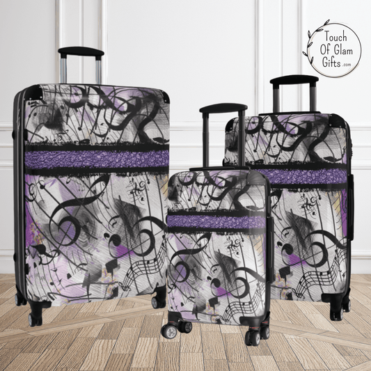 This colorful purple and black luggage set comes in three sizes and they all are identical with quality built wheels and handles.