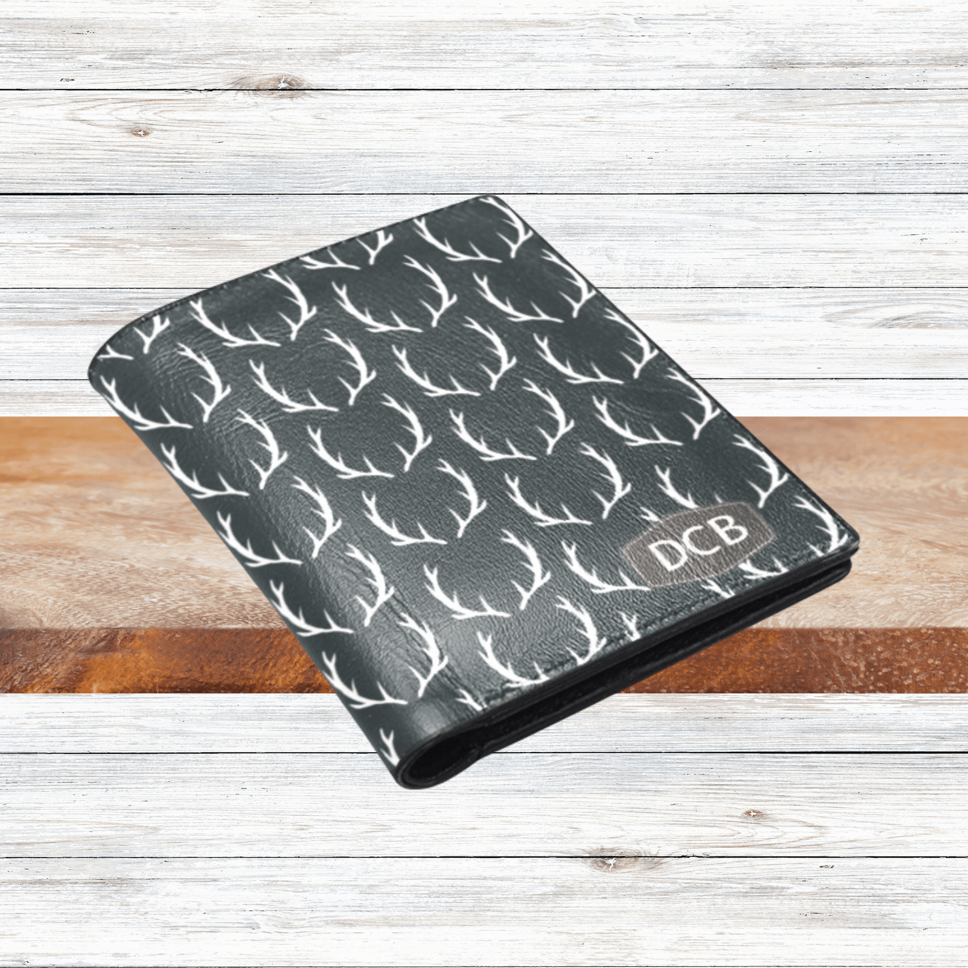 Our mens custom wallet is black with deer antlers and monogrammed initials in the corner and makes the perfect gift for the man that has everything.
